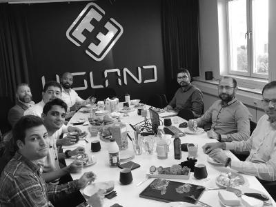 Colleagues gathered around a table during a shared breakfast